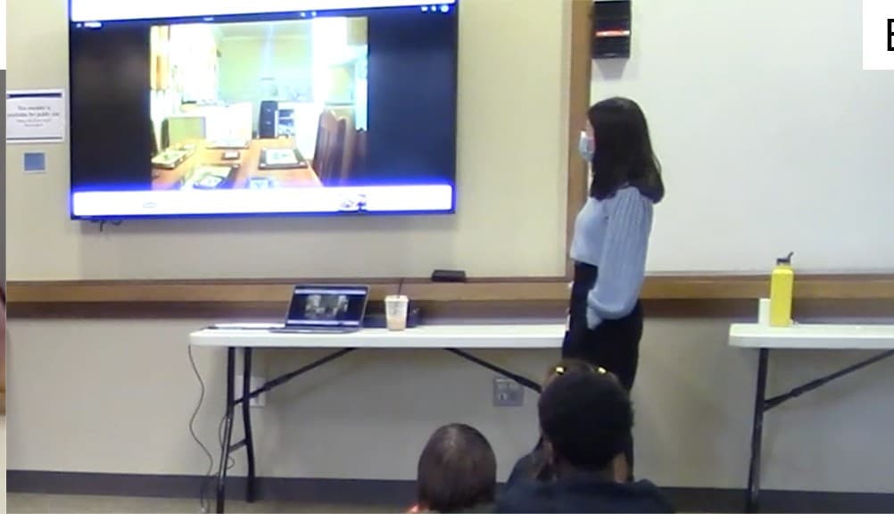 Children in a library watching and debating an online video of a ghost during a co-design session